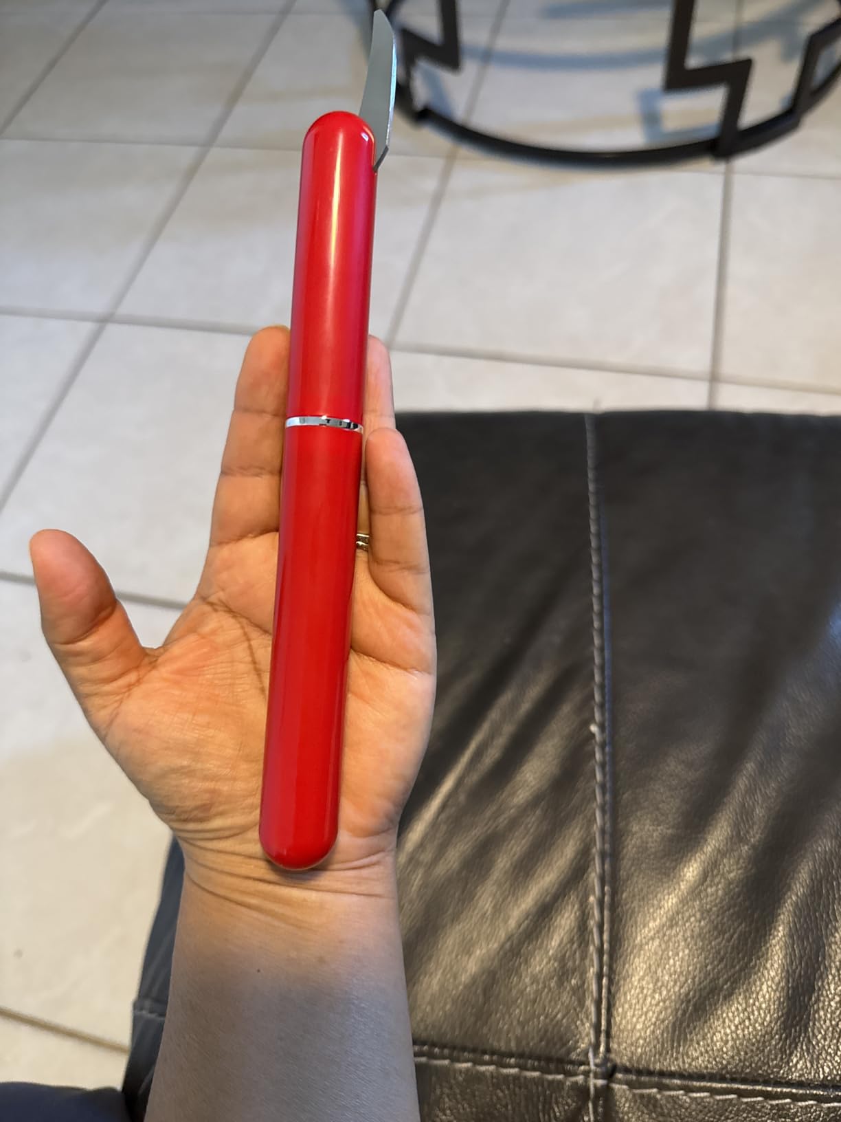 Red air pressure wine opener with foil cutter